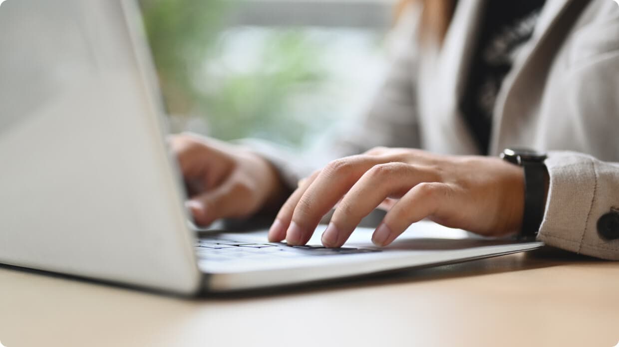 Person typing in laptop