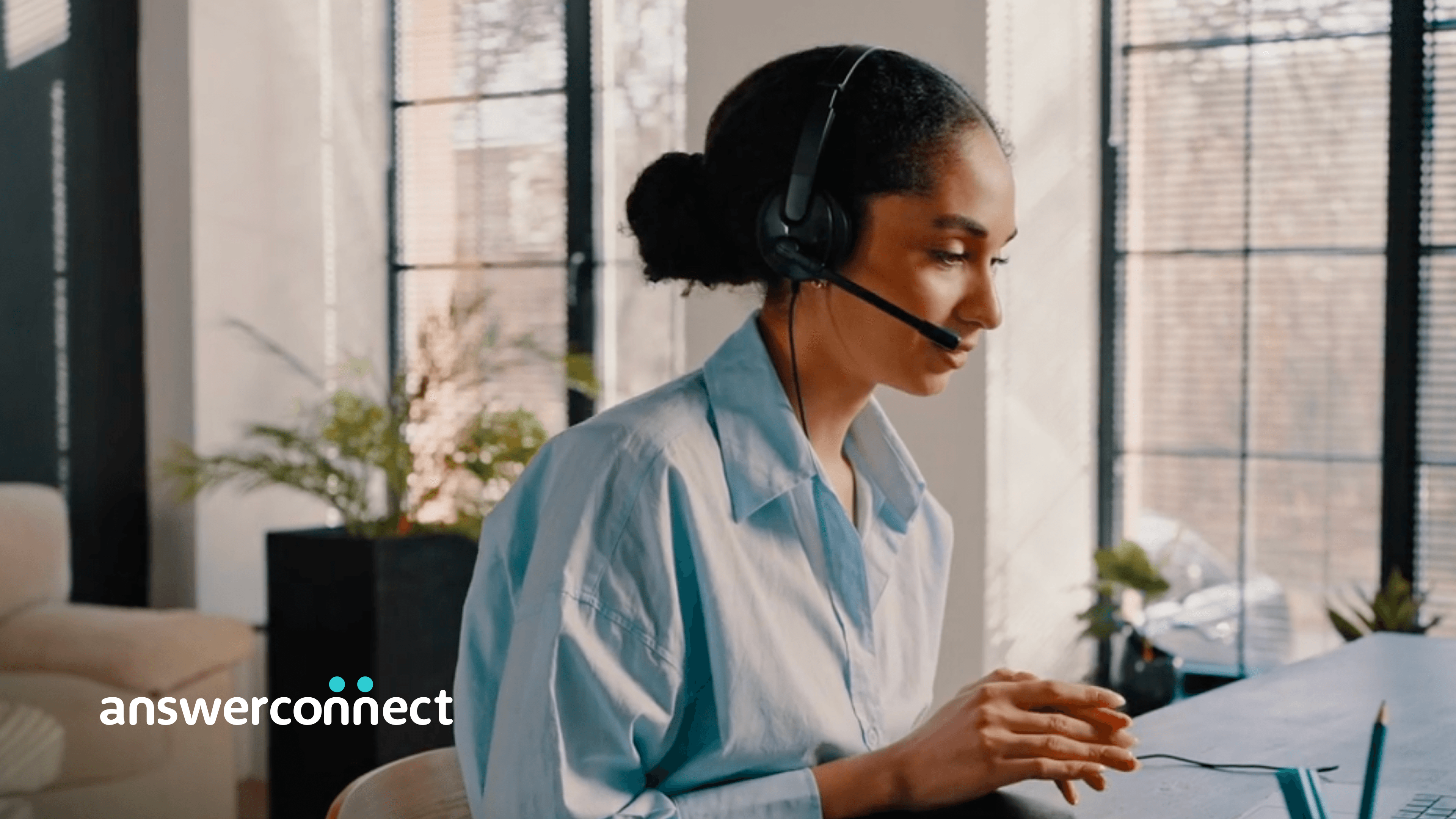 woman with headset typing 