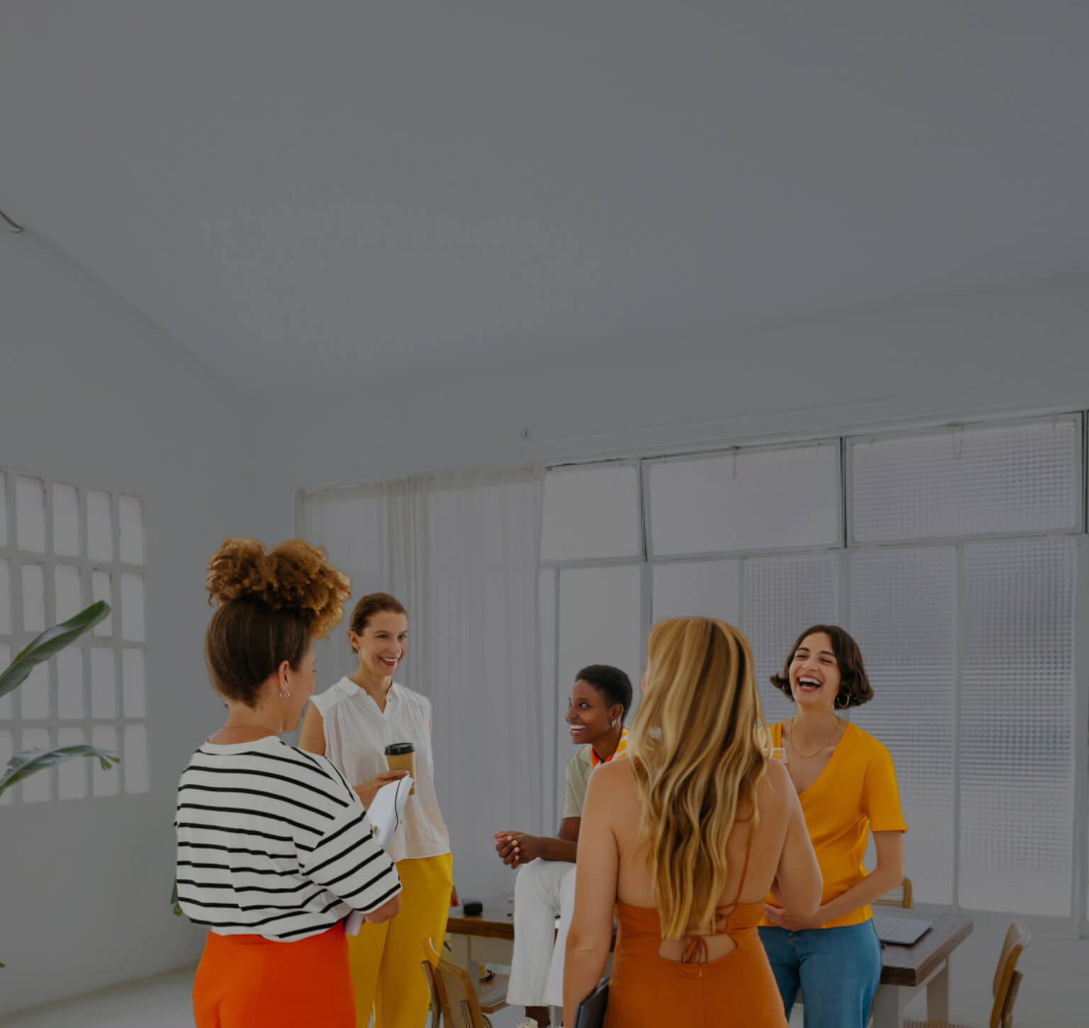 Group of people discussing tablet
