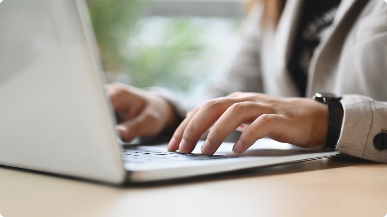 Person typing in laptop