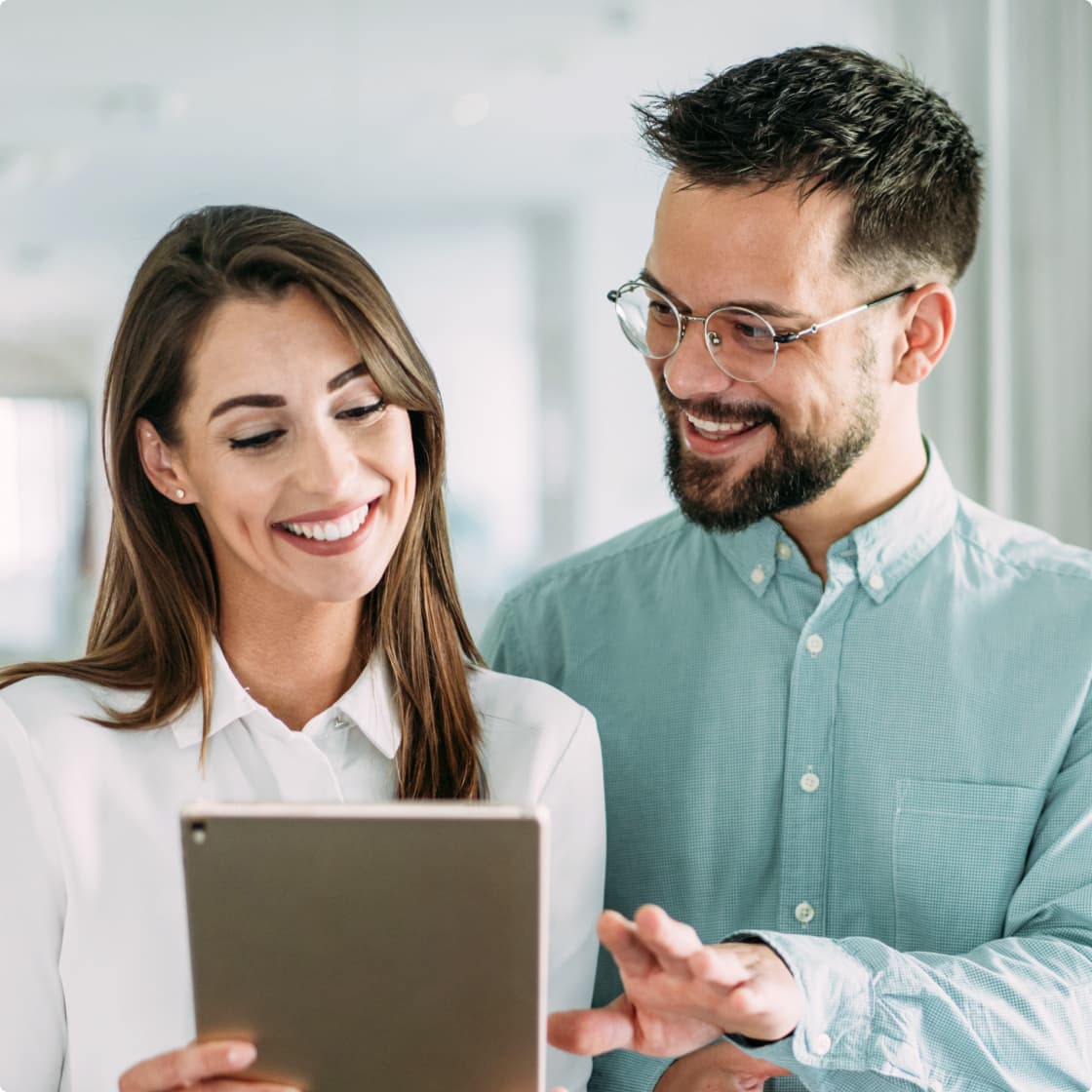 brunette man and woman working in office