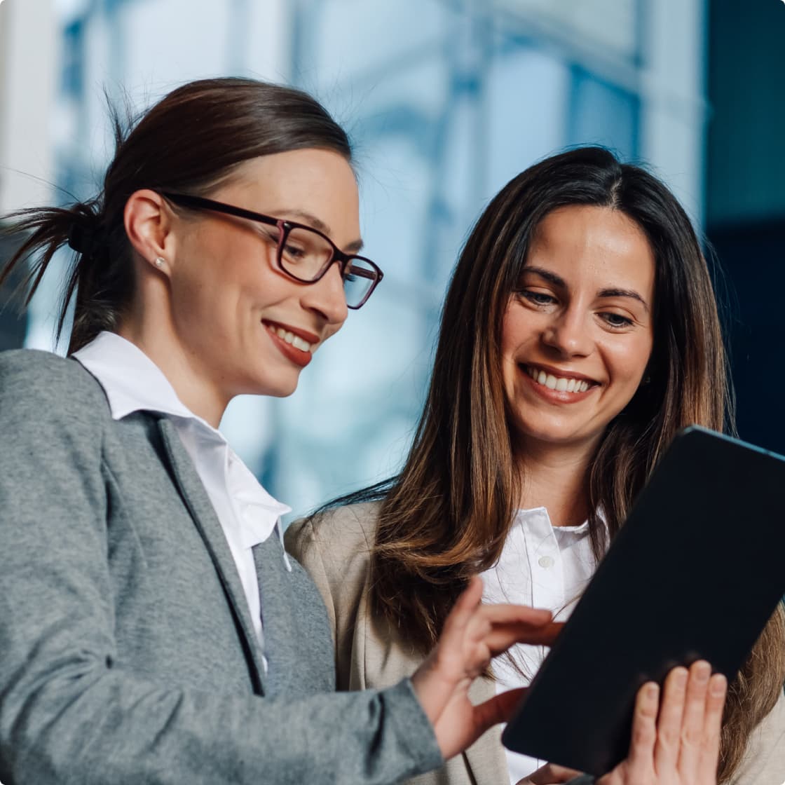 Two brunette ladies at office