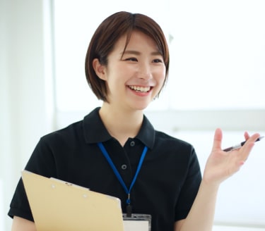 Woman with a writing pad engaging in a conversation