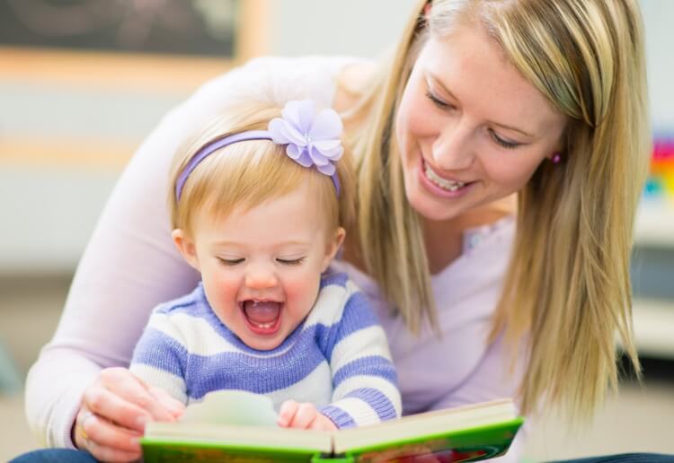 Mother sharing a book with her kid 2