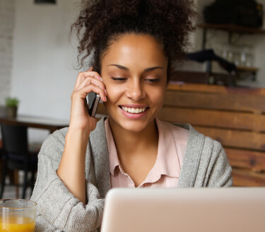 Curly haired woman on the phone