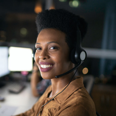 Lady receptionist wearing headphones