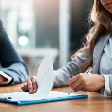 Lady signing documents