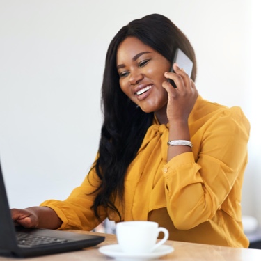 Lady with yellow dress answering phone call