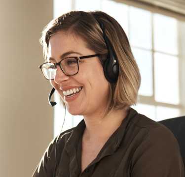 Smiling Female Receptionist with headset